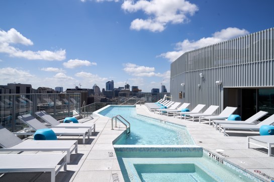 Rooftop pool with tables and chairs