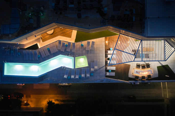 aerial view of rooftop pool at night in austin tx luxury apartments